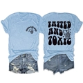 Detail of tatted and toxic graphic on light blue knit tee with distressed denim shorts - Light Blue (Black Graphic)