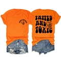 Front and back view of orange Tatted and Toxic t-shirt with ripped denim shorts set - Orange (Black Graphic)