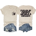 T-shirt grafica color avena mostrata in piano con logo sul petto e stampa sul retro - S / Sabbia (Carattere Nero)