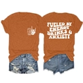 Détail d'un t-shirt orange en coton avec impression 'FUELED BY ENERGY DRINKS' au dos et graphique - Orange Brûlé (Police Blanche)