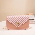 Pink printed crossbody bag with geometric floral pattern and gold chain strap - Pink