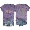 Flat lay of purple V-neck 1966 vintage tee with Chapter 60 print and denim shorts - Purple - Black Print