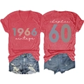 Flat lay of vintage 1966 women's V-neck T-shirt and denim shorts set for 60th birthday - Red