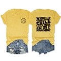 Flat lay of yellow cotton T-shirt with black letter print and ripped denim shorts - S / Tops / Yellow