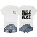 Detail of white cotton T-shirt featuring graphic text and distressed denim shorts ensemble - S / Tops / White