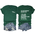 Flat lay showing front and back views of dark green cotton t-shirt with slogan prints - Retro Green (White Font)