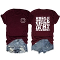 Detailed flat lay of burgundy graphic T-shirt and distressed denim shorts set - S / Tops / Wine Red / White Font