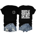 Flat lay of black cotton T-shirt with vintage white slogan and ripped denim shorts - S / Tops / Black / White Font