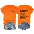 Detail of orange cotton t-shirt featuring YOU matter chest print and back graphic text - Orange (Black Font)