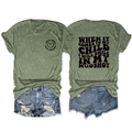 Detail showing the 'I WILL SMILE IN MY MUGSHOT' slogan print on an olive green T-shirt - S / Tops / Olive Green
