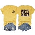 Flat lay of mustard yellow t-shirt with Feral Mama print and ripped denim shorts - S / Yellow