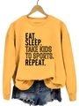 Détail du sweat-shirt jaune avec poignets côtelés et slogan Eat Sleep Take Kids imprimé - Jaune