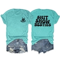 Detail of mint green Besties t-shirt with black graphic print and distressed denim shorts - Deep Water Blue