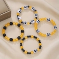 Set di braccialetti di perline per Halloween con perline nere arancioni e ciondoli teschio - Set di Braccialetti di Perline con Teschio / Set di 4 / Arancione Nero Bianco