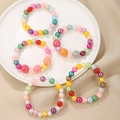 Bunte handgefertigte Perlenarmbänder-Set mit mehrfarbigen Herz- und Sternanhängern - Buntes Perlen-Set