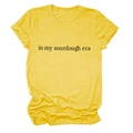 Close-up of 'in my sourdough era' black text on a yellow heather cotton t-shirt - S / Yellow (Black Font)