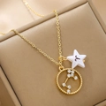 Macro detail of Aries zodiac gold necklace with star pendant and crystal circle - Aries