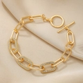 Elegante bracciale dorato a maglie ovali con strass e chiusura a levetta OT chic - Oro