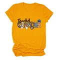 Close-up of Baseball Grandma print with leopard and star patterns on yellow cotton T-shirt - S / Mustard Yellow