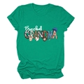 Close-up of Baseball GRANDMA graphic with bat and helmet print on green cotton t-shirt - S / Dark Green