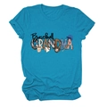 Close-up of Baseball Grandma graphic with bats and glove on a teal crewneck T-shirt - S / Lake Blue