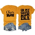 Detail view of the retro wave letter print on the back of the ginger cotton t-shirt - S / Mustard Yellow (Black Font)