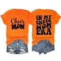 Front and back detail of orange Cheer Mom Era T-shirt with vintage slogan print - Orange (Black Font)