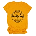 Close-up of black circular slogan print on ginger yellow cotton short sleeve T-shirt - S / Mustard Yellow (Black Text)