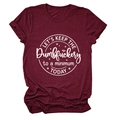 Close-up of Let's Keep the Dumbfuckery print on a burgundy cotton t-shirt fabric - Wine Red (White Font)