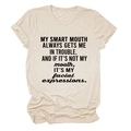 Detail of rolled cuffs and black slogan print on a cream crew neck cotton t-shirt - S / Sand (Black Font)