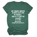 Close-up of white lettering print on a dark green heather crewneck short sleeve t-shirt - Vintage Green (White Font)