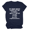 Detailed close-up of navy blue cotton T-shirt with white humor quote and rolled sleeves - Navy Blue (White Font)