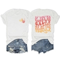 Détails au dos d'un t-shirt blanc vintage et d'un short en jean bleu avec déchirures - Blanc