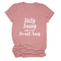 Detail of rose pink t-shirt with white Sixty Sassy AND A BIT Smart Assy printed text - Rose Gold (White Font)