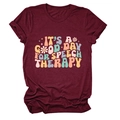 Close-up of retro floral text print on a burgundy crew neck cotton speech therapy t-shirt - Burgundy