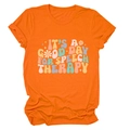 Close-up of orange cotton t-shirt featuring retro 'Speech Therapy' graphic and soft fabric texture - Orange