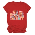 Close-up of retro graphic print and vibrant red cotton fabric of the casual t-shirt - Red