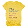 Close-up of bright yellow cotton t-shirt with It's A Good Day To Talk print texture - Yellow