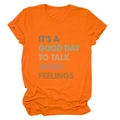 Detail of orange cotton T-shirt featuring 'IT'S A GOOD DAY TO TALK' typography - Orange