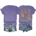 Flat lay of purple In My Gigi Era t-shirt with daisy print and ripped denim shorts set - Purple