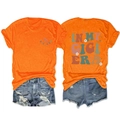 Front and back detail of In My Gigi Era orange t-shirt with daisy floral print and denim shorts - Orange
