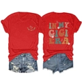 Detail view of red GIGI ERA t-shirt with daisy and butterfly prints and denim shorts - Red
