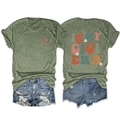 Close-up of 'IN MY GIGI ERA' colorful retro print and daisy pattern on army green t-shirt - Olive Green