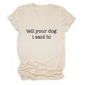 Close-up of oatmeal t-shirt featuring tell your dog i said hi slogan and fabric texture - S / Sand (Black Font)
