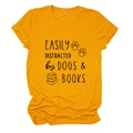 Flat lay of ginger yellow t-shirt showing Easily Distracted by Dogs and Books print - Mustard Yellow (Black Font)