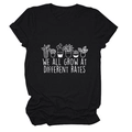 Detailed view of plant art print and We All Grow at Different Rates text on black tee - S / Black (White Letters)