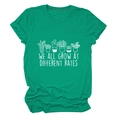Close-up of emerald green t-shirt featuring potted plants and motivational text print - S / Dark Green (White Letters)