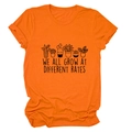 Detail of orange cotton T-shirt featuring botanical print and motivational typography - S / Orange (Black Letters)