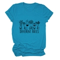 Detail of teal cotton T-shirt featuring potted plant prints and inspirational text - S / Lake Blue (Black Letters)
