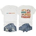 Flat lay of women's white t-shirt and ripped denim shorts with colorful retro typography - White